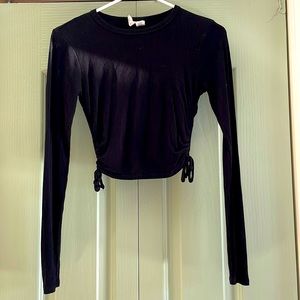 Cropped black long sleeve shirt with rigged sides